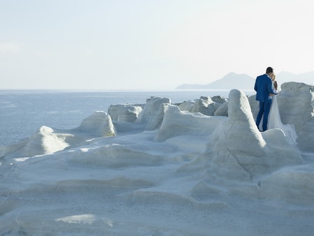 Art photo of bride and groom in white rocks. Fashion weddingの写真素材