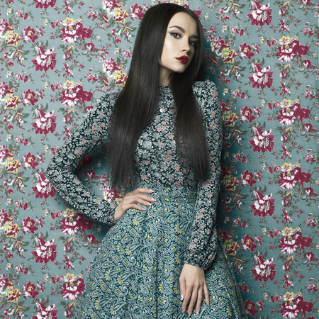 Fashion art photo of beautiful elegant lady on floral background. Spring-Summerの写真素材
