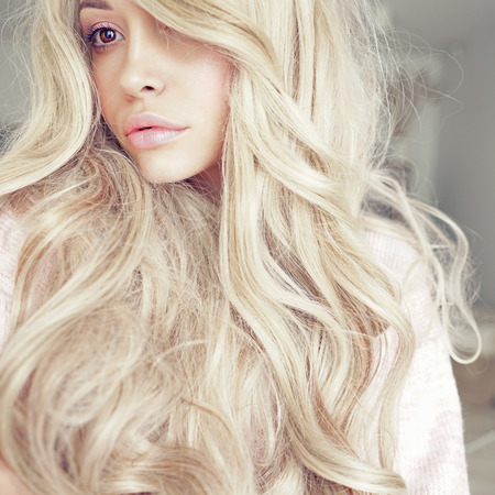 Lifestyle photo of beautiful blonde woman. Calm, harmony and beautyの写真素材