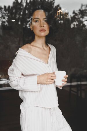 Woman with cup of coffeeの写真素材