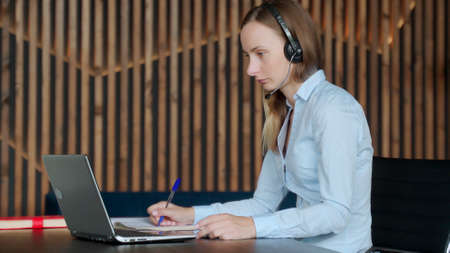 Excited business woman celebrates success in the workplace