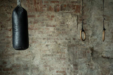 Empty fight club with punching bag for practicing martial arts.の写真素材