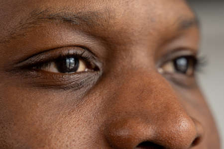 Close-up of a black mans eyes. Eyes of a thoughtful manの写真素材