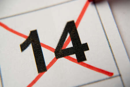 The 14st number in the calendar is crossed out with a red cross in a macro on a white sheet....