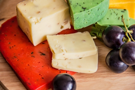 cheeses on a cutting boardの写真素材