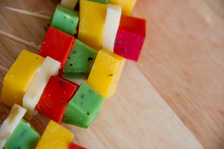 cheeses on a cutting boardの写真素材