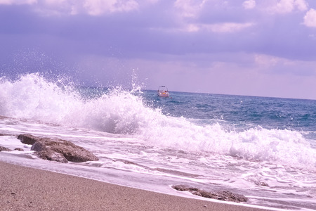 waves on coastline and blue clouds skyの写真素材