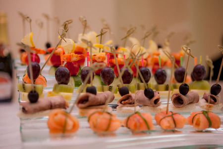 canapes with salmon, meat and fruitsの写真素材