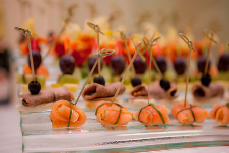 canapes with salmon, meat and fruitsの写真素材