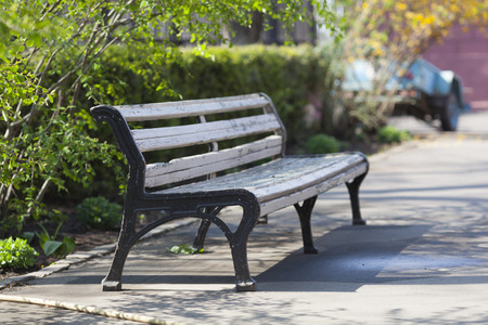 The bench to sit in city park.