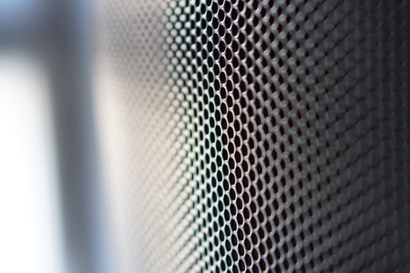 Grid texture hi-tech cell honeycomb background. High-tech view with macro backlight.