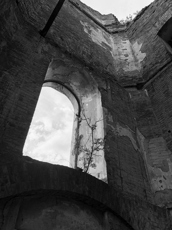 Burnt abandoned interior of an old catholic church in Ukraine, background for mystical kozharovaniya.の写真素材