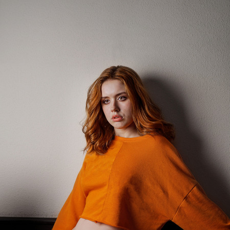 Portrait of a girl Red hair image of a natural lifestyle of modern youth, real emotions, good concept.の写真素材