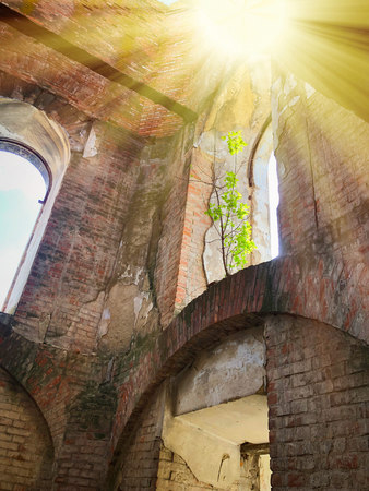 Burnt abandoned interior of an old catholic church in Ukraine, background for mystical kozharovaniya.の写真素材