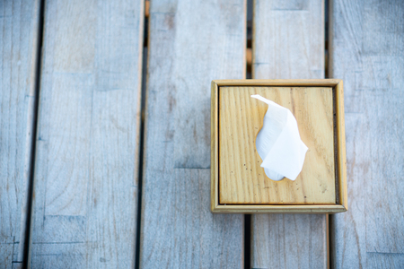 Soft focus, napkin box a restaurant accessory on a wooden old table of bar.の写真素材