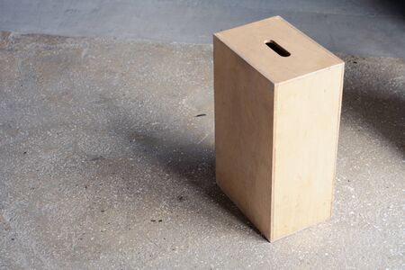 Wooden boxes with holes on each end used chiefly in film production.