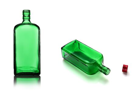 Empty alcohol bottles of different color glass. White isolate background.の写真素材