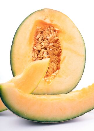 Cut Natural Melon, a healthy product full of vitamins. For advertising vegan food and lifestyle.の写真素材
