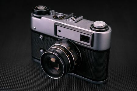 Old vintage film 36mm photo camera, lifestyle memory. Take pictures with a manual lens history.の写真素材