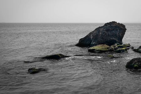 Seascape rock in the waterの写真素材