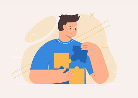 Business concept. Man connecting puzzle elements or jigsaw pieces, abstract shapes on the...