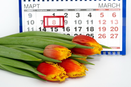 Bouquet of tulips on the background of the calendar. March 8 - international women's day