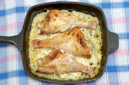 Sea bass baked in a pan with onion and cream sauceの写真素材