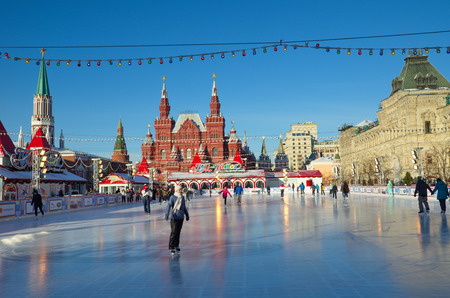 Moscow, Russia - December 7, 2016: The GUM-skating rink on the red square in Moscow. People ride on...