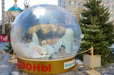 Moscow, Russia - January 9, 2018: The Festival Journey to Christmas. Glass ball with moving polar animals on Tverskaya square. Christmas and New Year holidaysのeditorial素材