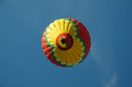 Flying balloon on blue sky backgroundの写真素材