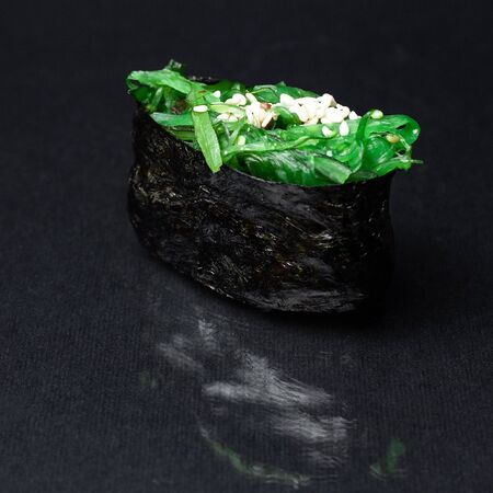 gunkan sushi on a black background. menuの写真素材