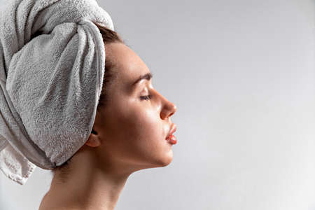 Close-up portrait of a cute brunette European smiling woman. makeup. beautyの写真素材