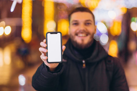 Man holding smartphone with blank screen. copy space