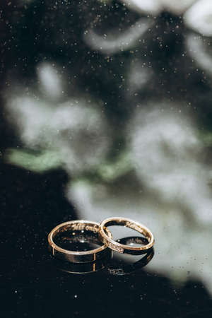 wedding rings with flowers before the wedding ceremonyの写真素材
