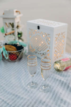 wedding ceremony table with glasses and wedding boxの写真素材