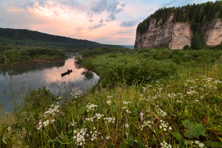 Sunrise on the river. Man fishing.の写真素材