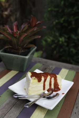 Crepe cake with strawberry sauceの写真素材