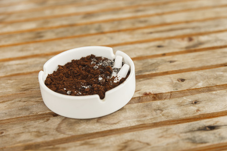 Burning cigarette in ashtrayの写真素材