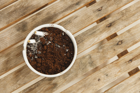 Burning cigarette in ashtrayの写真素材