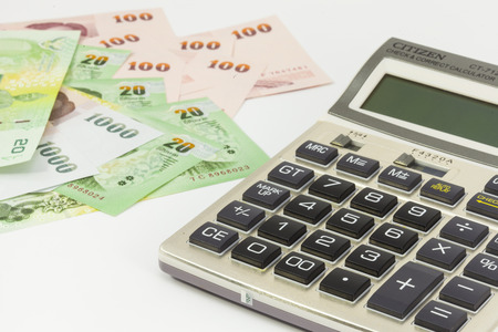 Calculator and cash background.の写真素材