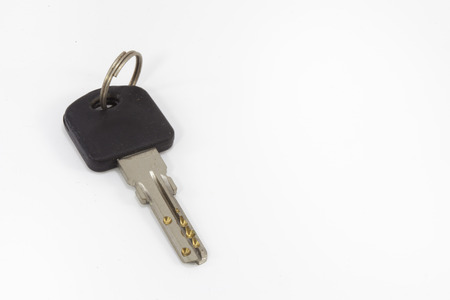 Black plastic key isolatedの写真素材