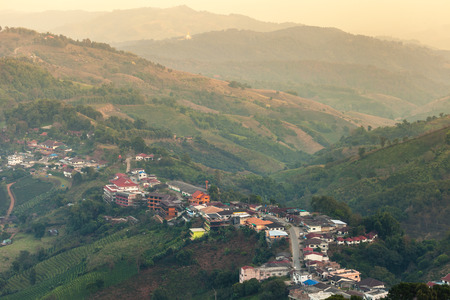Bird eye view of village of mountain, Doi Mae Salong, Chiang Rai, Thailandの写真素材