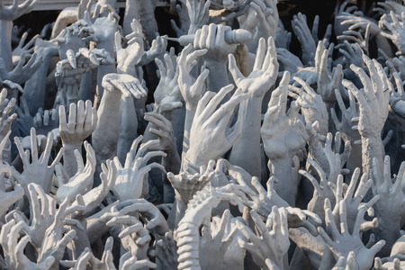 Hand from hell at Wat Rong Khun is the Buddhist temple in Chiangrai, Thailand.の写真素材