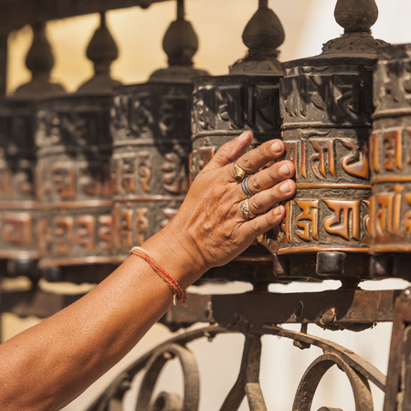 Tibetan prayer wheels or prayer's rolls of the faithful Buddhists.の写真素材