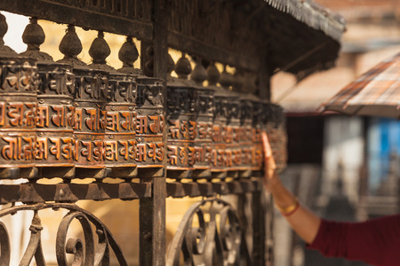 Tibetan prayer wheels or prayer's rolls of the faithful Buddhists.の写真素材