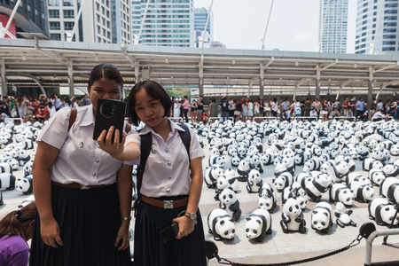 Bangkok,Thailand - Mar 08, 2016 : 1600 Pandas+ TH,Paper Mache Pandas campaign at Skywalk Sathon by WWF to represent awareness of panda conservation for endangered animals in Thailand.のeditorial素材