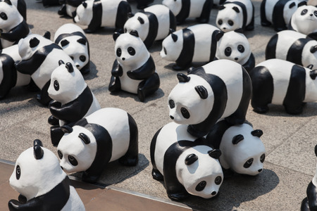 Bangkok, Thailand - March 8, 2016 : 1600 Pandas+ TH, Flash mob of paper mache Pandas on March 8, 2016. This campain of WWF to represent 1,600 Pandas still remaining  and to raise awareness in conservation for endangered animals in Thailand.のeditorial素材