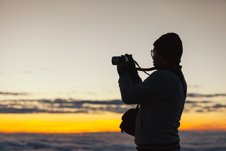 CHIANG MAI, THAILAND - DEC 7, 2015 : Man taking the picture of sunrise at Doi Luang Chiang Dao Mountain, Chaing mai, Thailand on 7 December 2015のeditorial素材