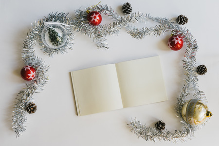 Christmas concept with empty blank book with Christmas decorations on white background.の写真素材