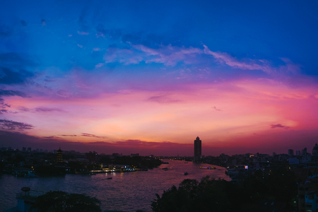 Cityscape of Bangkok chao phraya river in sunset.の写真素材